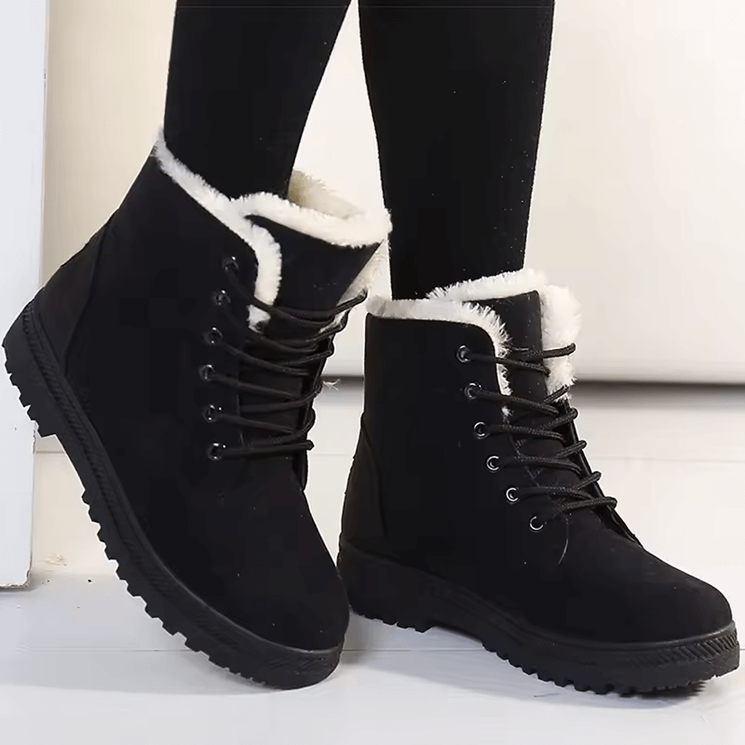 Botines mujer Bruma Fuerte color negro con forro blanco de peluche y diseño resistente